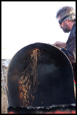 Image of man cutting barrel