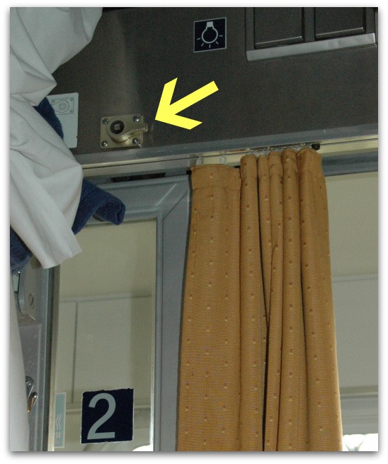 Train with door lock marked with an arrow