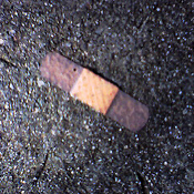 Bandaid on sidewalk Creative Commons licensed courtesy of KevinDean's Flickr photostream