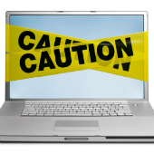 Laptop with caution tape