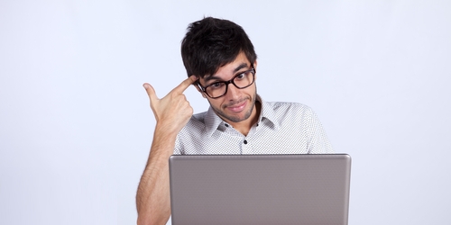 Man at computer. Image from Shutterstock