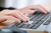 Fingers on keyboard, courtesy of Shutterstock