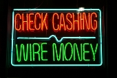 Wire money neon sign. Image from Shutterstock