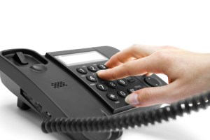fingers dialling phone number