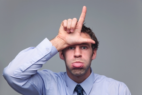 Loser sign, blowing raspberries. Image from Shutterstock
