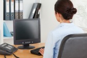Woman at computer, courtesy of Shutterstock