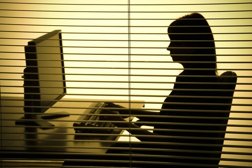 Woman at desk, courtesy of Shutterstock