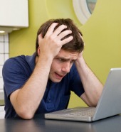 Worried computer user, courtesy of Shutterstock