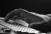 Fingers on keyboard, courtesy of Shutterstock
