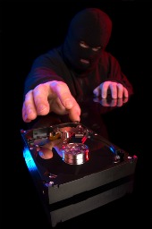 Thief steal hard drive. Image from Shutterstock