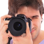 Man with camera, image courtesy of Shutterstock
