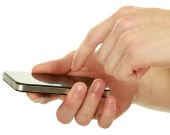 Hands on smartphone. Image courtesy of Shutterstock