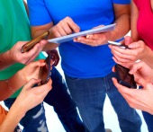Group with smartphones. Image courtesy of Shutterstock