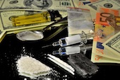 Image of drugs and money courtesy of Shutterstock