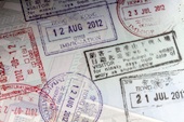 Passport stamps image courtesy of Shutterstock