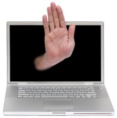 Hand and computer. Image courtesy of Shutterstock