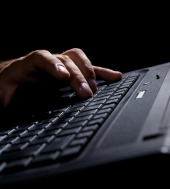 Man's hands on keyboard. Image courtesy of Shutterstock