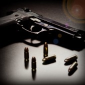 Image of gun courtesy of Shutterstock. Filters applied. 