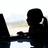 Child on computer. Image courtesy of Shutterstock