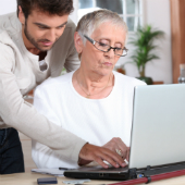 Image of people using computer courtesy of Shutterstock