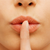 Finger on lips. Image courtesy of Shutterstock