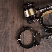 Iamge of gavel and handcuffs courtesy of Shutterstock