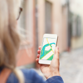 Image of tourist using navigation app on mobile phone  courtesy of Shutterstock.