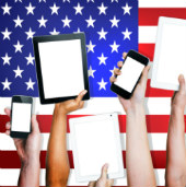 American's holding their tablets and phones, courtesy of Shutterstock