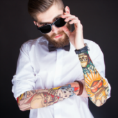 Image of tattooed hipster courtesy of Shutterstock